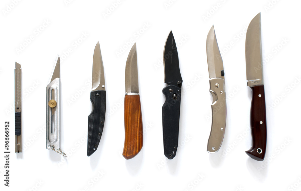 Knife set in line over white Knife set in line over white