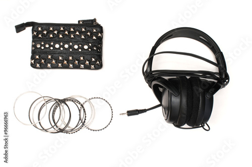 Studded wallet with bracelets and headphones photo