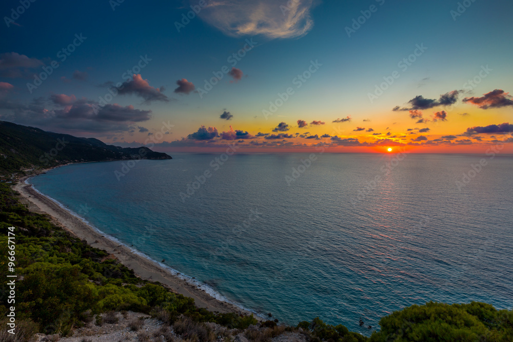 Fototapeta premium Pefkoulia beach Lefkada at sunset / Pefkoulia beach near the Agios Nikitas village on Lefkada, Greece 