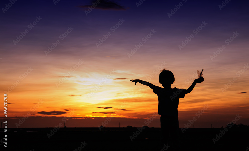 children playing the sun at sunset