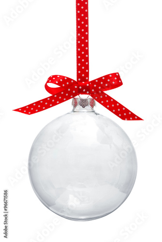Transparent Christmas ball hanging on red ribbon against white background