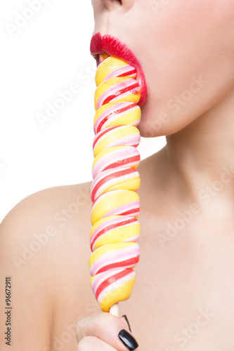 Close-up shot of woman's mouth and lollipop