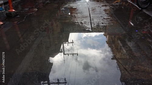 puddle in the street after rain photo