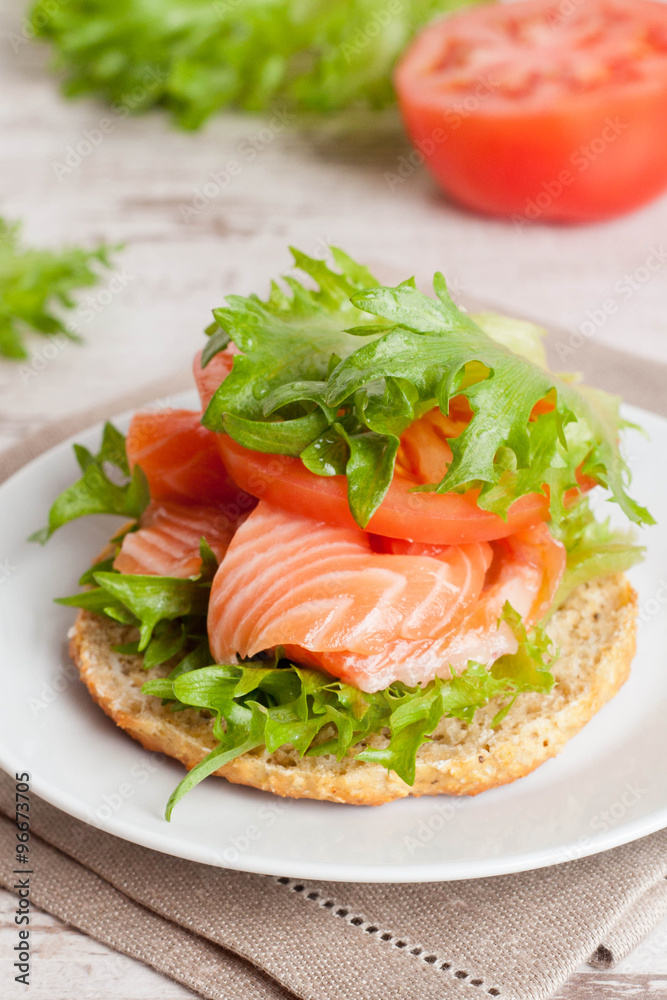 sandwich with cheese, tomato and salmon, close-up