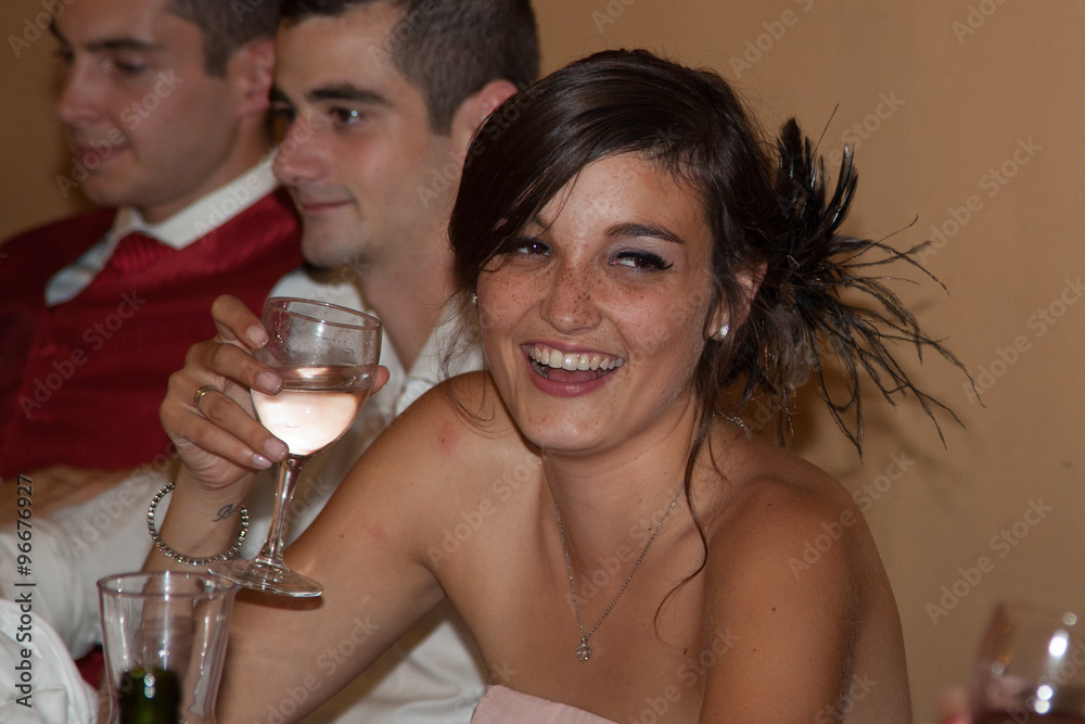 Attractive elegant young girl drinking a cocktail at the restaurant.