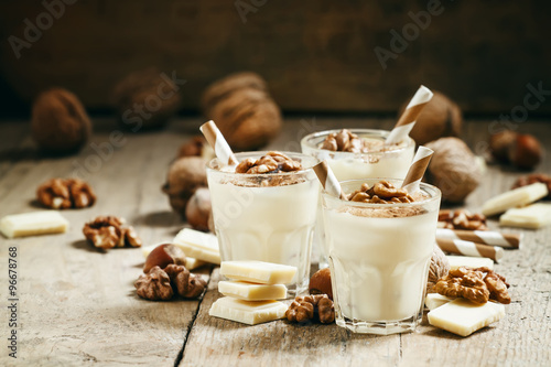Fotografie Dessert of white chocolate and walnuts, selective focus