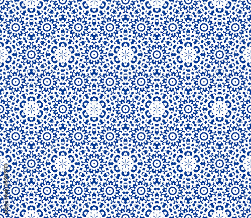 Gentle winter pattern. White lace on a light blue background