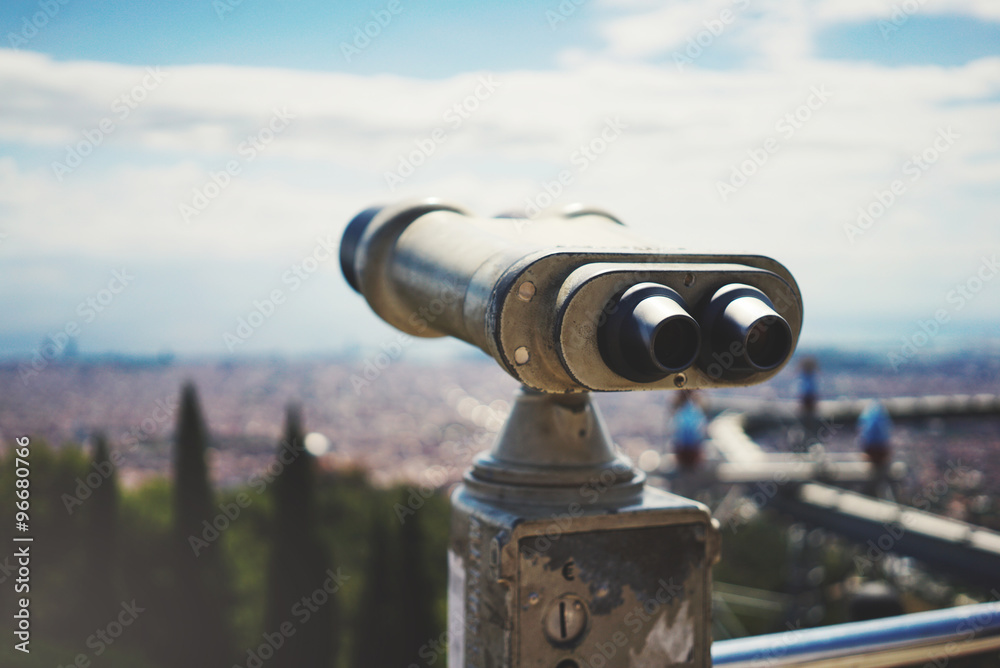 Сoin-operated binoculars overlooking the panorama of the city