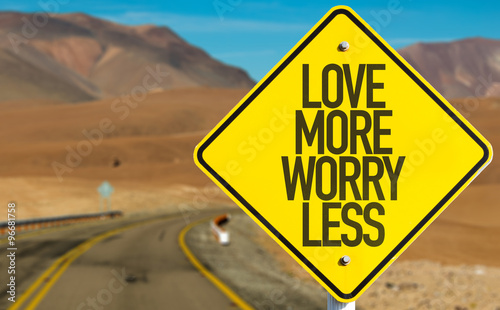 Love More Worry Less sign on desert road
