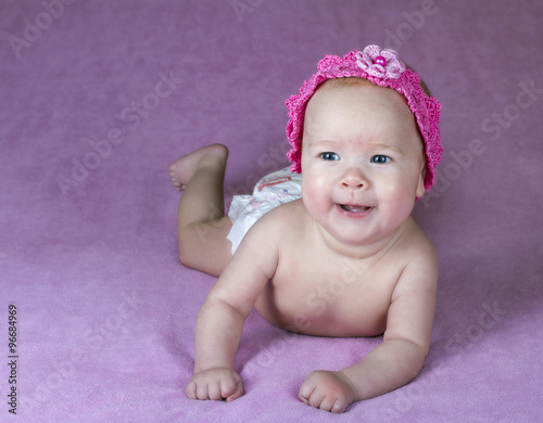 infant isolated on a pink background