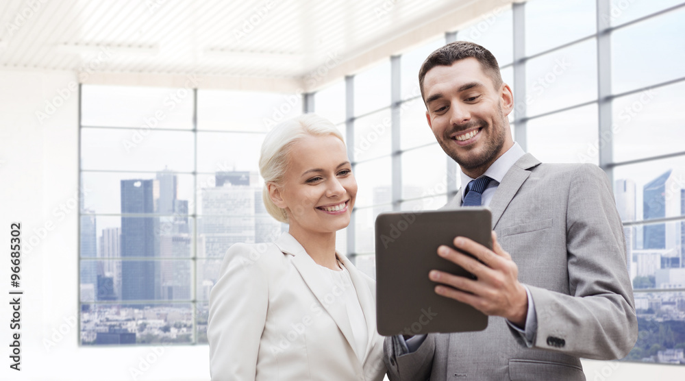 smiling businessmen with tablet pc outdoors