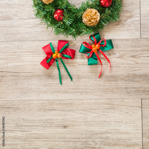 Christmas wreath and ribbon bow on wooden background ( Composition and space for text )