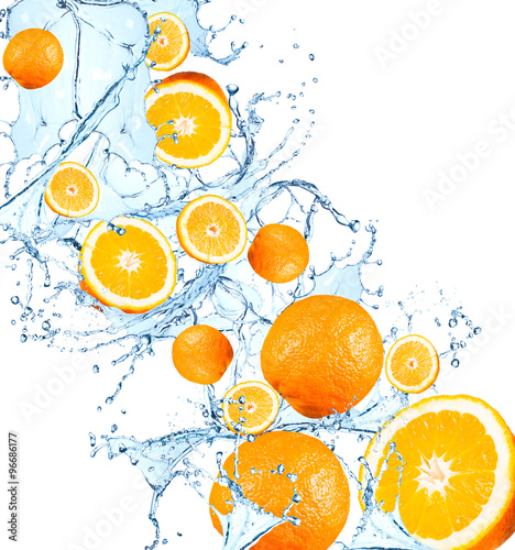 Fresh fruits, orange falling in water splash, isolated on white background