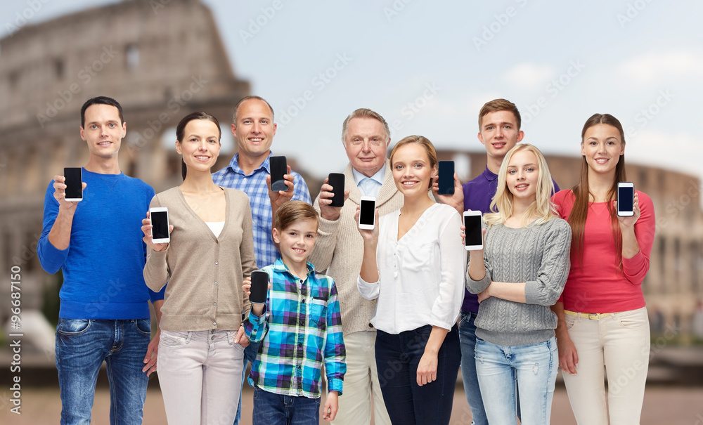 Fototapeta premium group of people with smartphones over coliseum