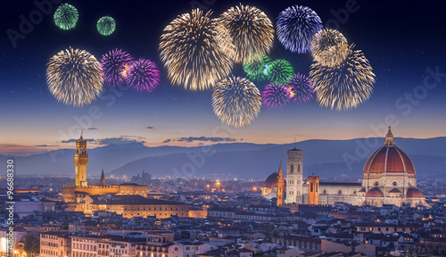 Beautiful fireworks under Arno River and Ponte Vecchio at sunset, Florence