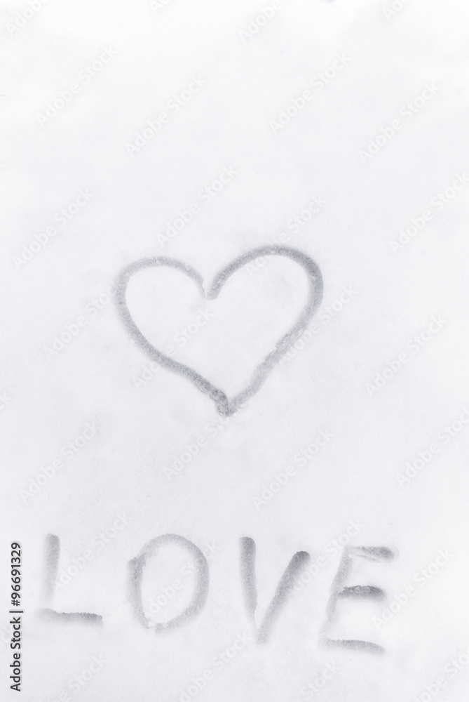 Love heart sign writen on the snow