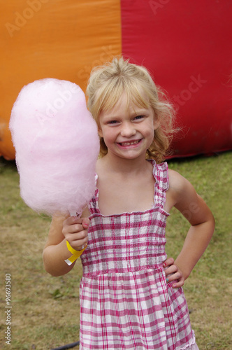 young girl with pink cotton candy 