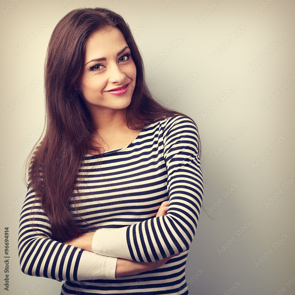 Cute smiling casual woman with folded hands looking happy on blu Cute smiling casual woman with folded hands looking happy on blu
