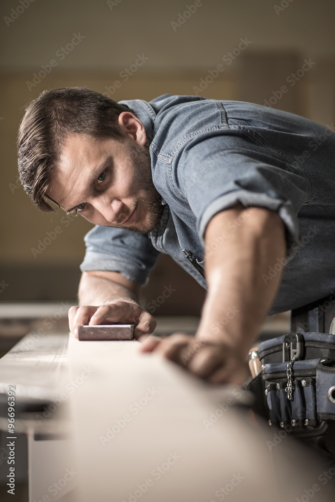 Joiner polishing wooden board Joiner polishing wooden board