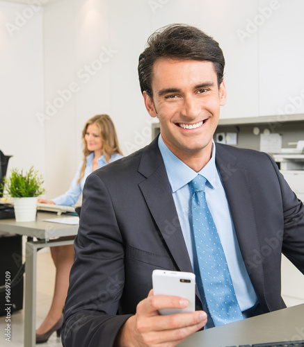 Businessman at his desk wit...