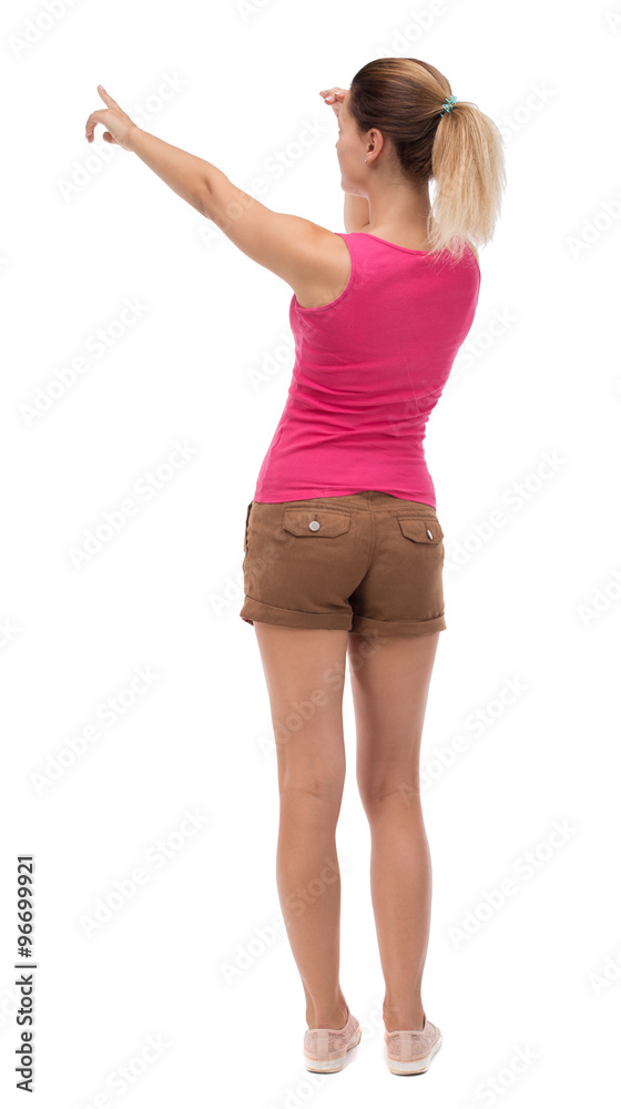 Back view of pointing woman. Back view of pointing woman.