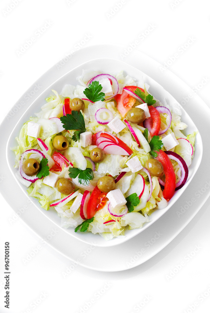 The Greek and Italian food - fresh vegetable salad on the table.