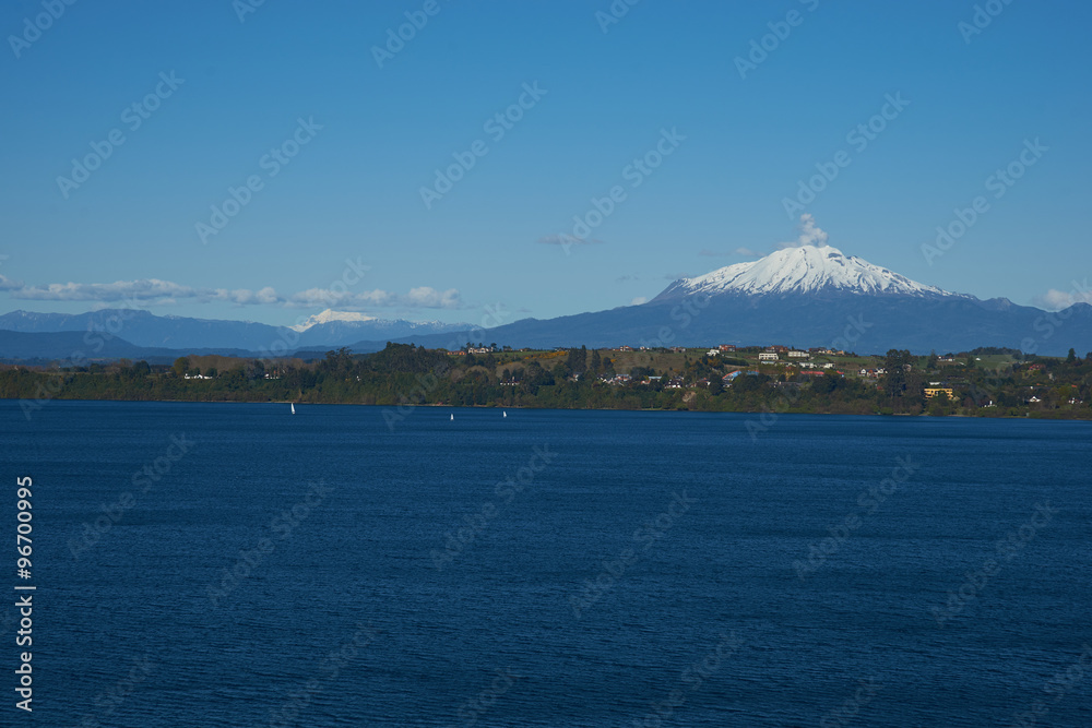 Snow capped Volcano Calbuco (2,105 metres) on the edge of Llanquihue Lake in Southern Chile. Viewed from Puerto Varas.