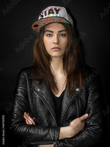 Beautiful girl portrait wearing basket cap and leather jacket © patronestaff