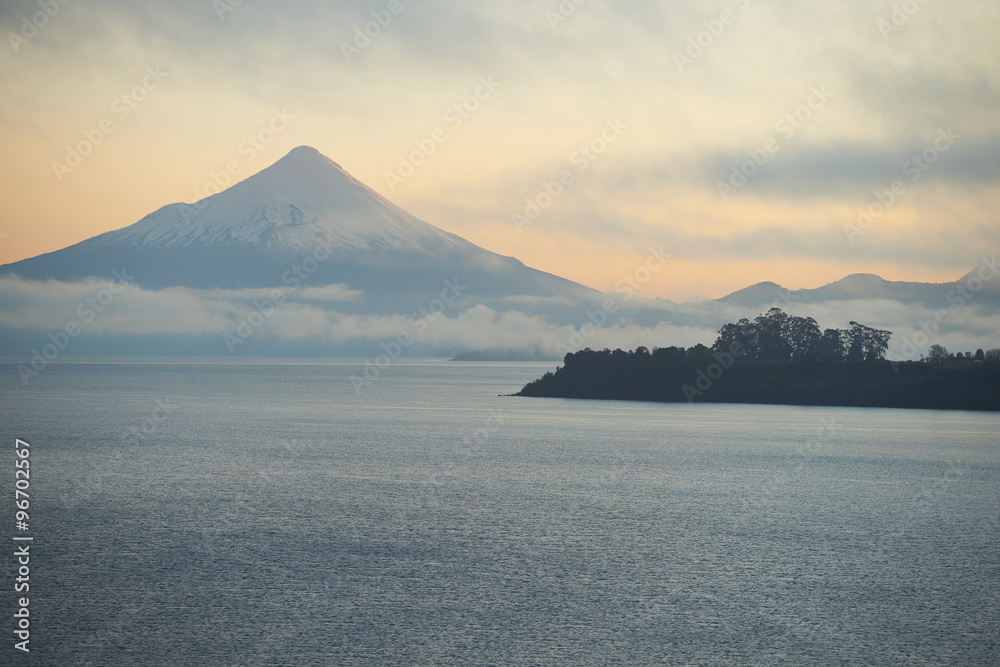 Sunrise over Snow capped Volcano Osorno (2,652 metres) on the edge of Llanquihue Lake in Southern Chile. Viewed from Puerto Varas.