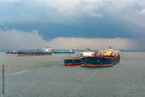 Canvas Print Loading anchored oil supertanker via a ship-to-ship oil transfer