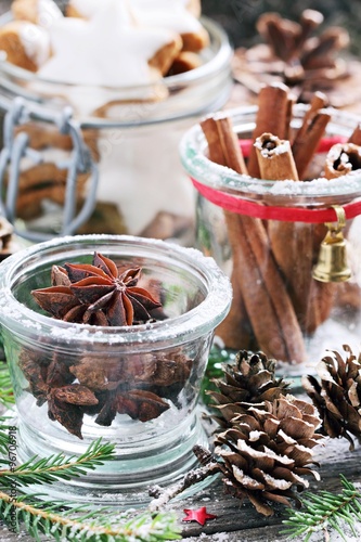 Christmas traditional spices and cookies on a festive rustic wooden table.Selective focus. 