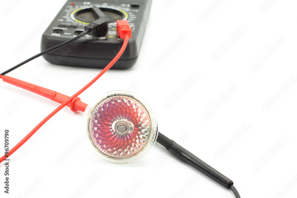 Electrician checking .lamp with digital multimeter Electrician checking .lamp with digital multimeter