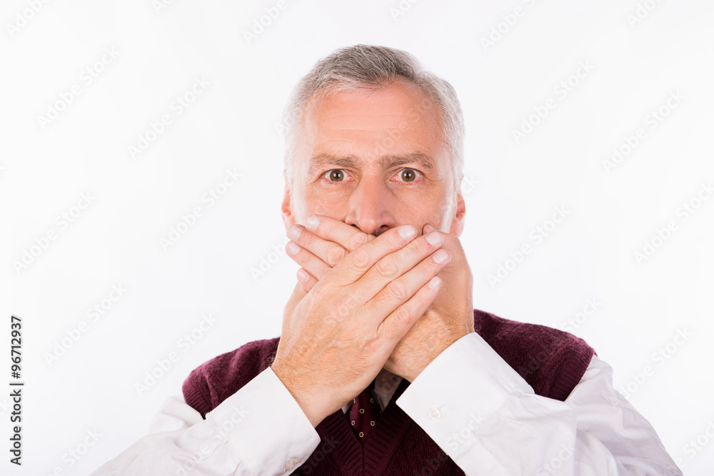 Handsome confident businessman with gray beard shutting mouth