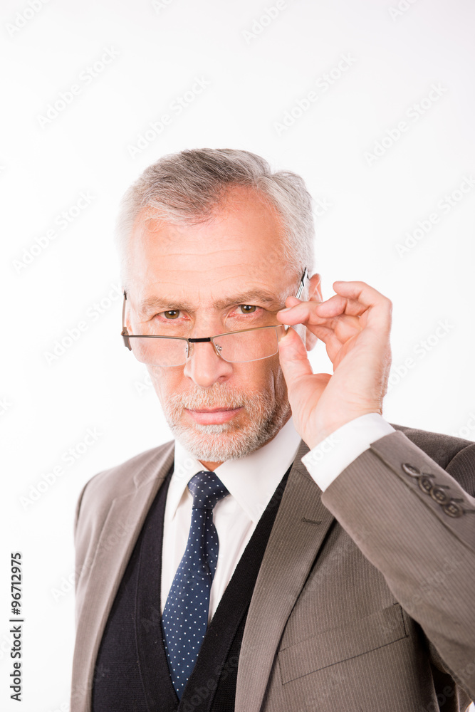 Old businessman in an elegant suit with glasses Old businessman in an elegant suit with glasses
