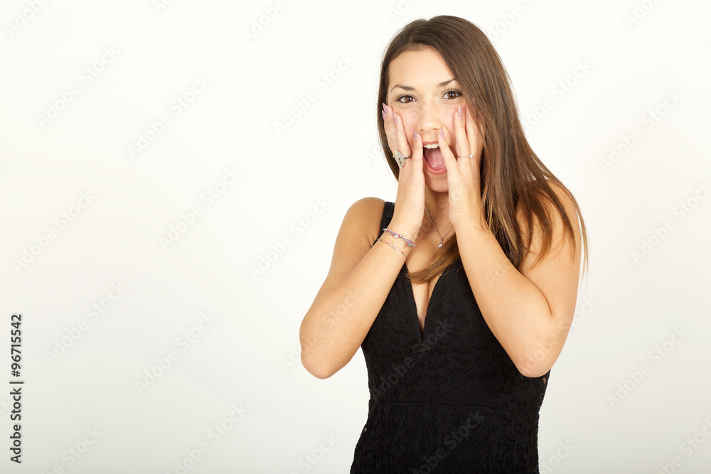 A frustrated and angry woman is screaming out loud and pulling her face A frustrated and angry woman is screaming out loud and pulling her face
