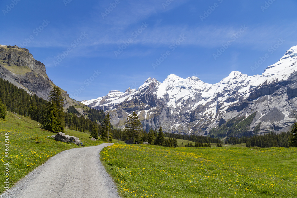 Amazing view of Swiss Alps and meadows near Oeschinensee Lake in Switzerland