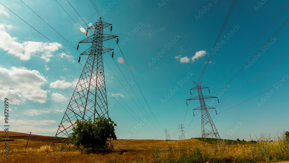 4K high voltage electricity pylon,power lines in countryside tracking timelapse