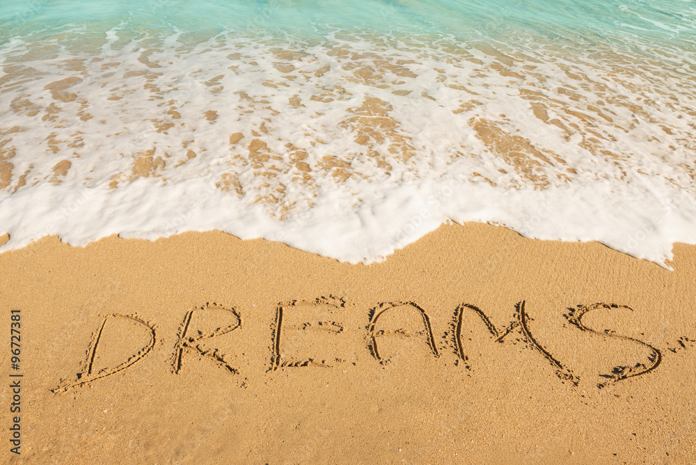 Fototapeta premium Dreams message on the sand