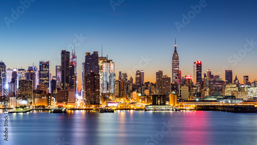 New York City skyline at dawn, as viewed from Weehawken, along the 42nd street canyon