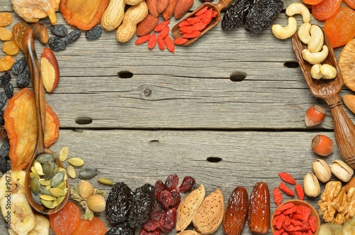 Mix of dried fruits and nuts - symbols of judaic holiday Tu Bishvat. Copyspace background.Top view.