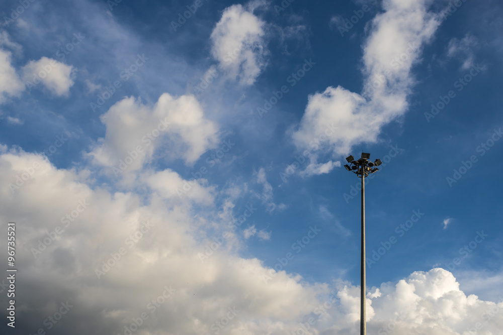 spotlight post (high mast) on sky,black and white cloud backgrou spotlight post (high mast) on sky,black and white cloud backgrou