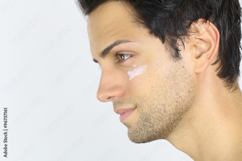 Close portrait of a man with moisturizer on her face Close portrait of a man with moisturizer on her face