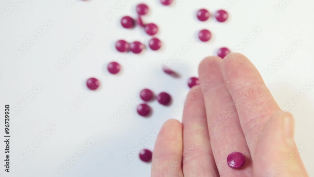 Pills droping and white background Pills droping and white background
