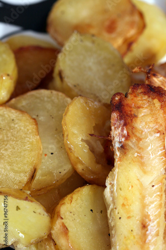 cooked and oily  golden yellow french fried potatoes 