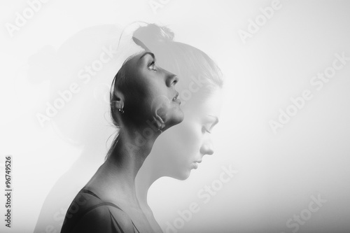 Double exposure with young and beautiful girl, monochrome photo