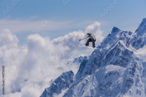 Flying snowboarder on mountains. Extreme sport. © Vasily Merkushev