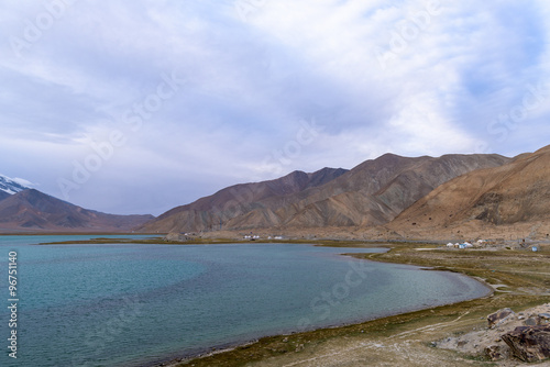 Landscape of Karakul lake  in Xinjiang province of China lies on the Karakoram Highway linking Kashgar in China with Islamabad in Pakistan. It s in the Pamir mountain range.