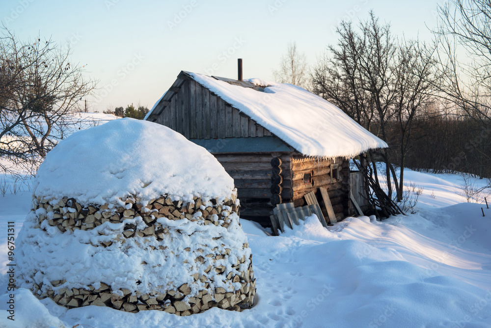 Russian traditional banya (banja) and stack of firewood. Russian traditional banya (banja) and stack of firewood.