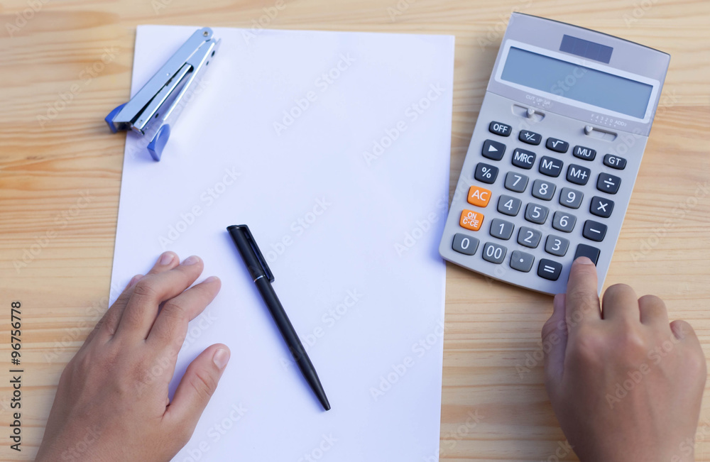 Business people's working hand on calculator Business people's working hand on calculator