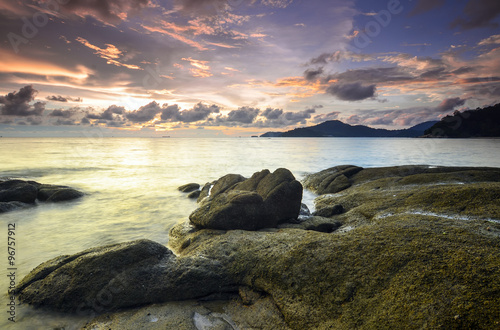 sunrise at rocky beach in terengganu, malaysia. image taken with